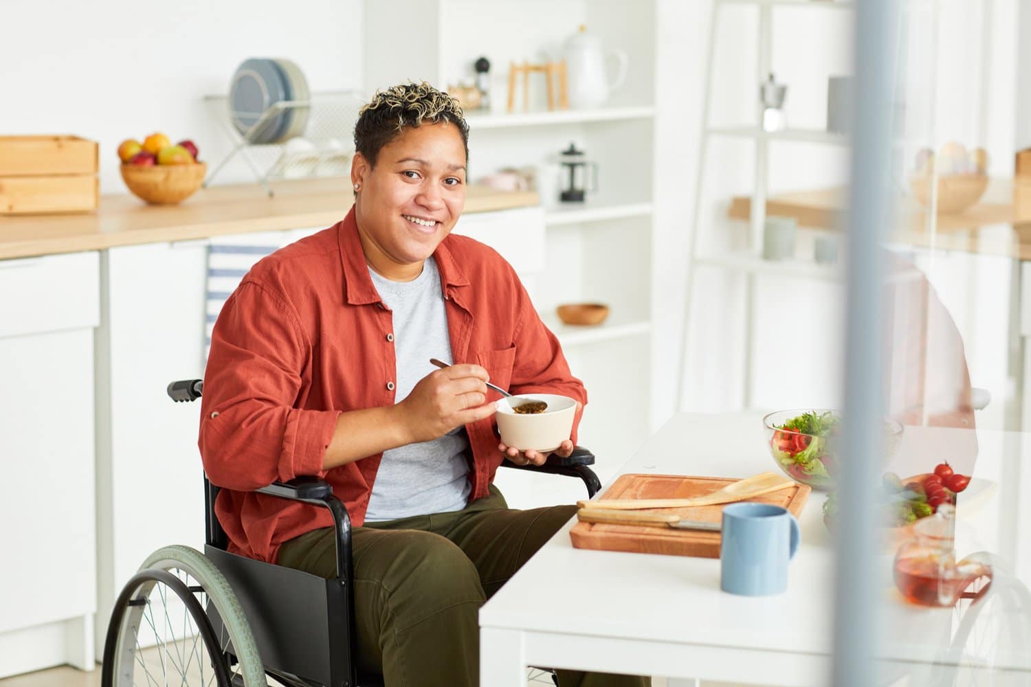 Disabled woman having diet breakfast to loss weight